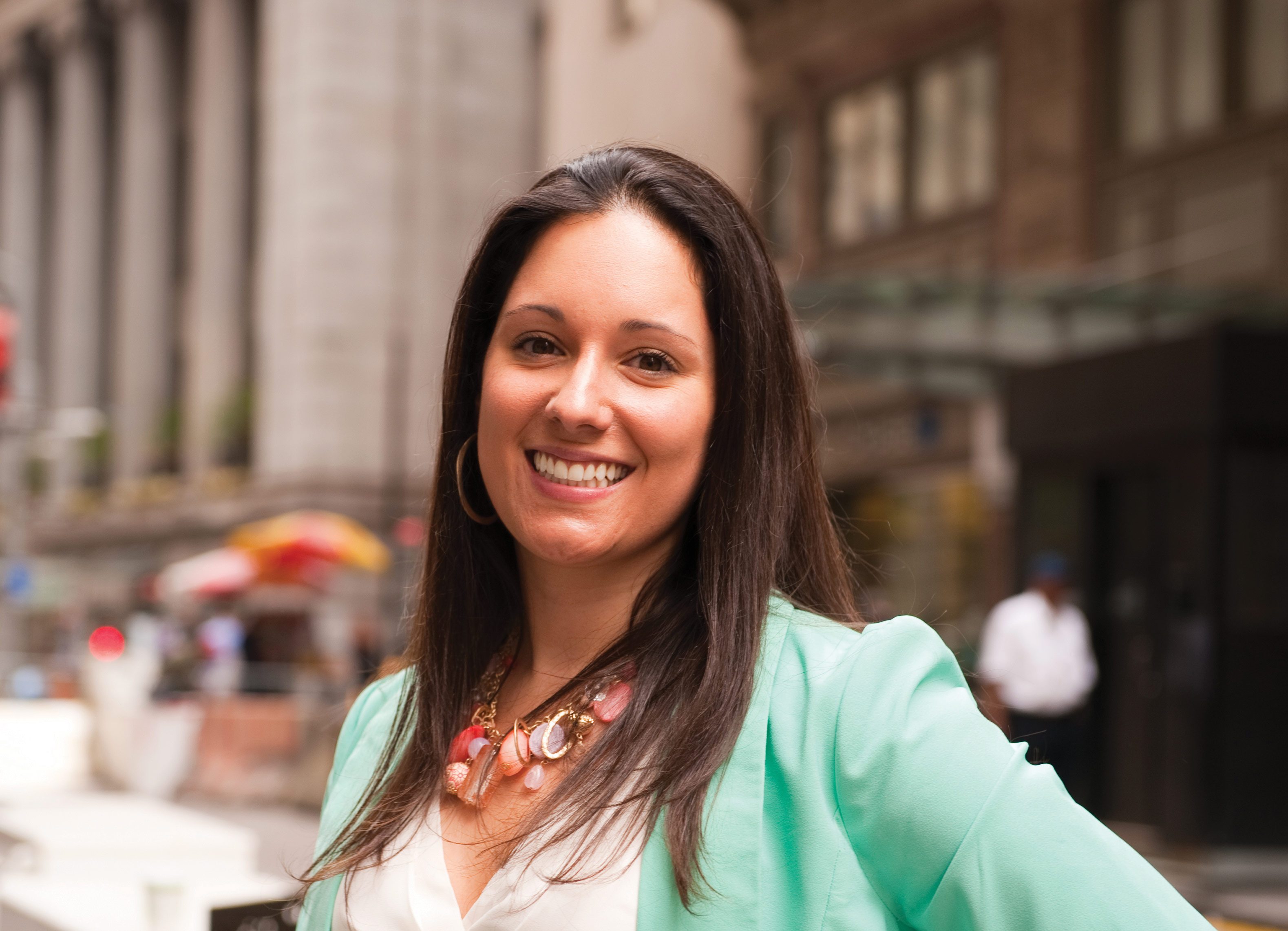 Iona student, smiling, in downtown New York.