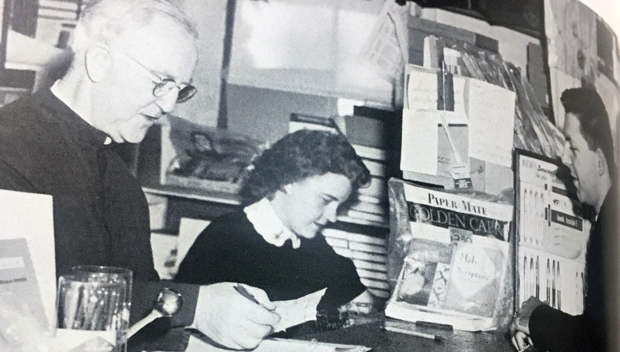 An old black and white of Brother Mulvaney and a nun working in the book store.