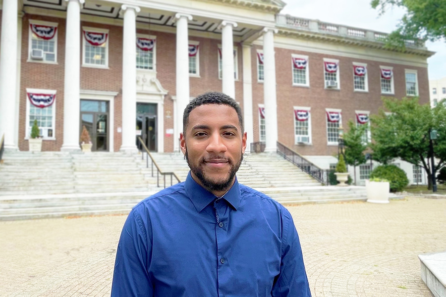 Isaiah Williams ’23  stands in front of Mount Vernon City Hall.