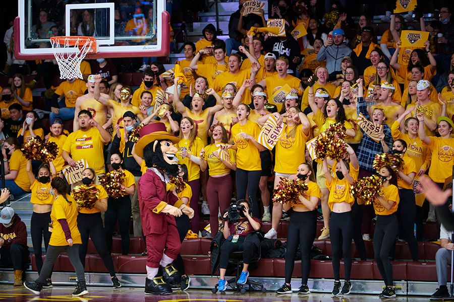 Students cheer at an Iona home basketball game.