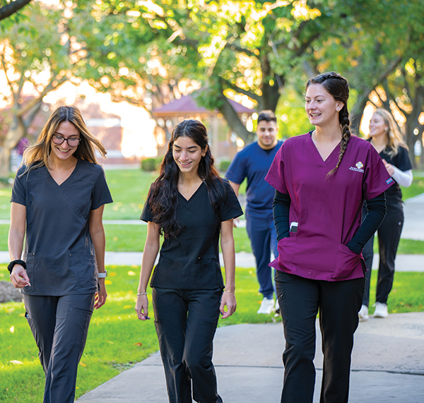Three nursing students walk on the Bronxville Campus.