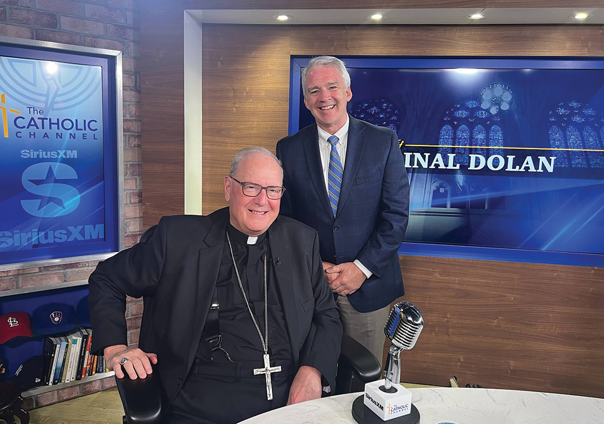 Cardinal Dolan and President Carey.