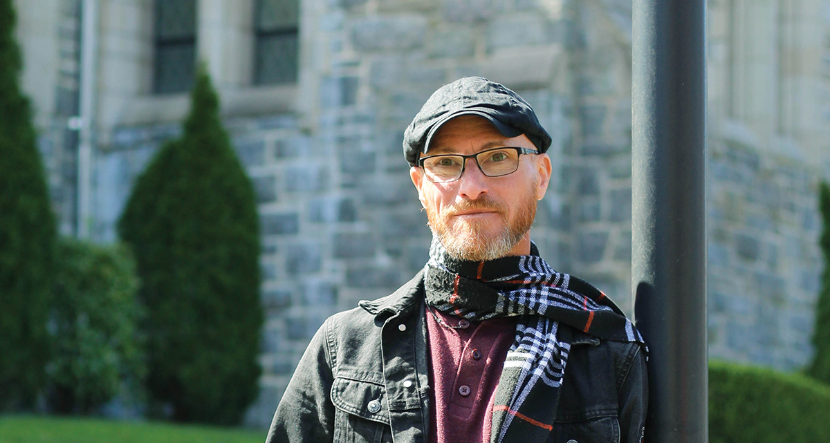 Dr. Daniel Thiery stands outside of Arrigoni Center.